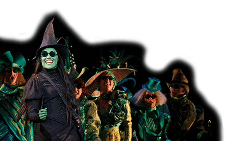 Elphaba in the Emerald City With the Ensemble Behind Her