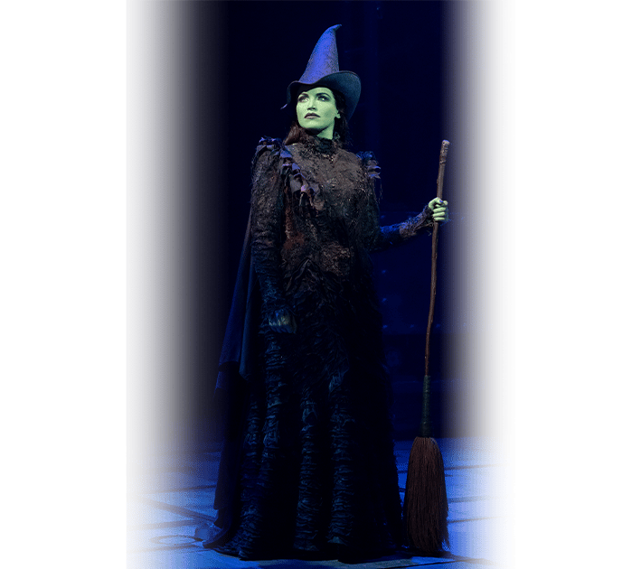 Elphaba Holding Broom and Standing Tall