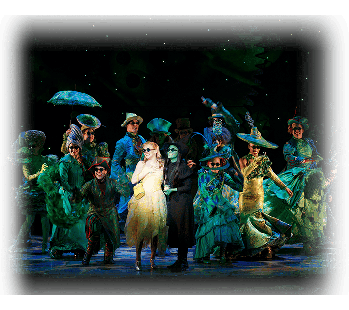 Glinda and Elphaba in the Emerald City With Ensemble Members in the Background